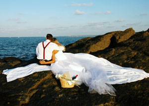 Newlyweds watching the ocean